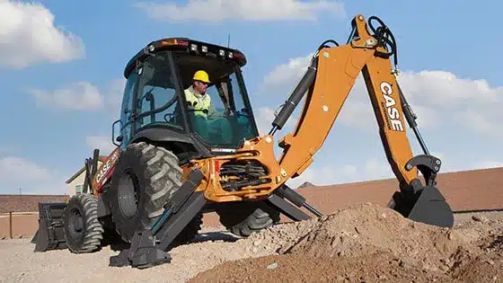 CASE Backhoe digging in dirt