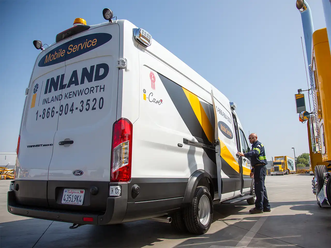 An Inland Kenworth mobile service technician opening the door of his mobile service van.