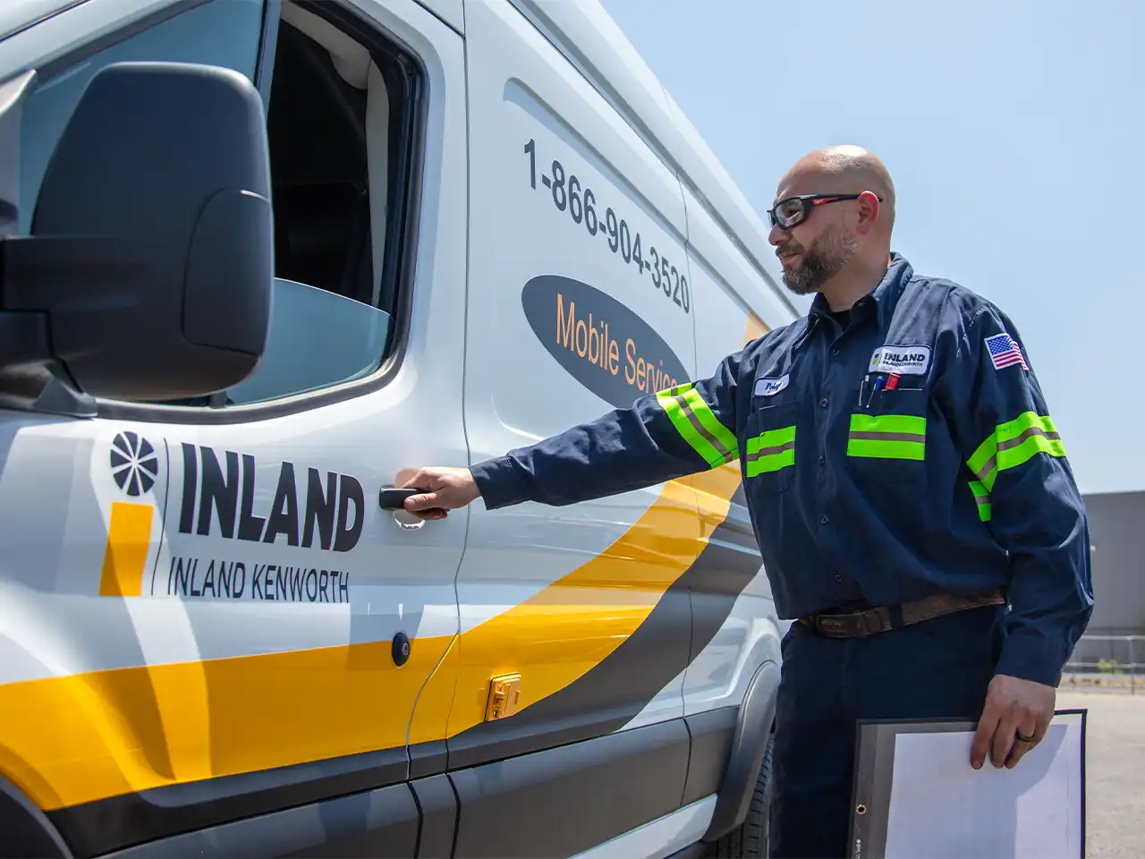 An Inland Kenworth mobile truck technician getting ready to head to a service call location.